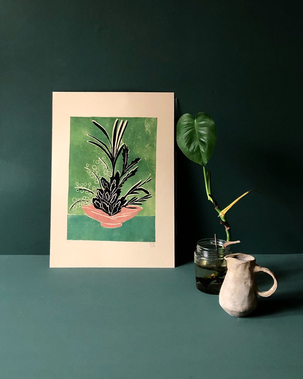 Contemporary illustrated postcard of flowers in a bowl propped up against a green background